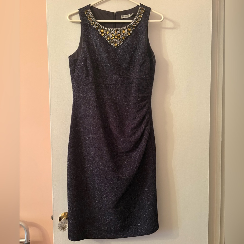 Elegant Black Sleeveless Dress with Embellished Neckline